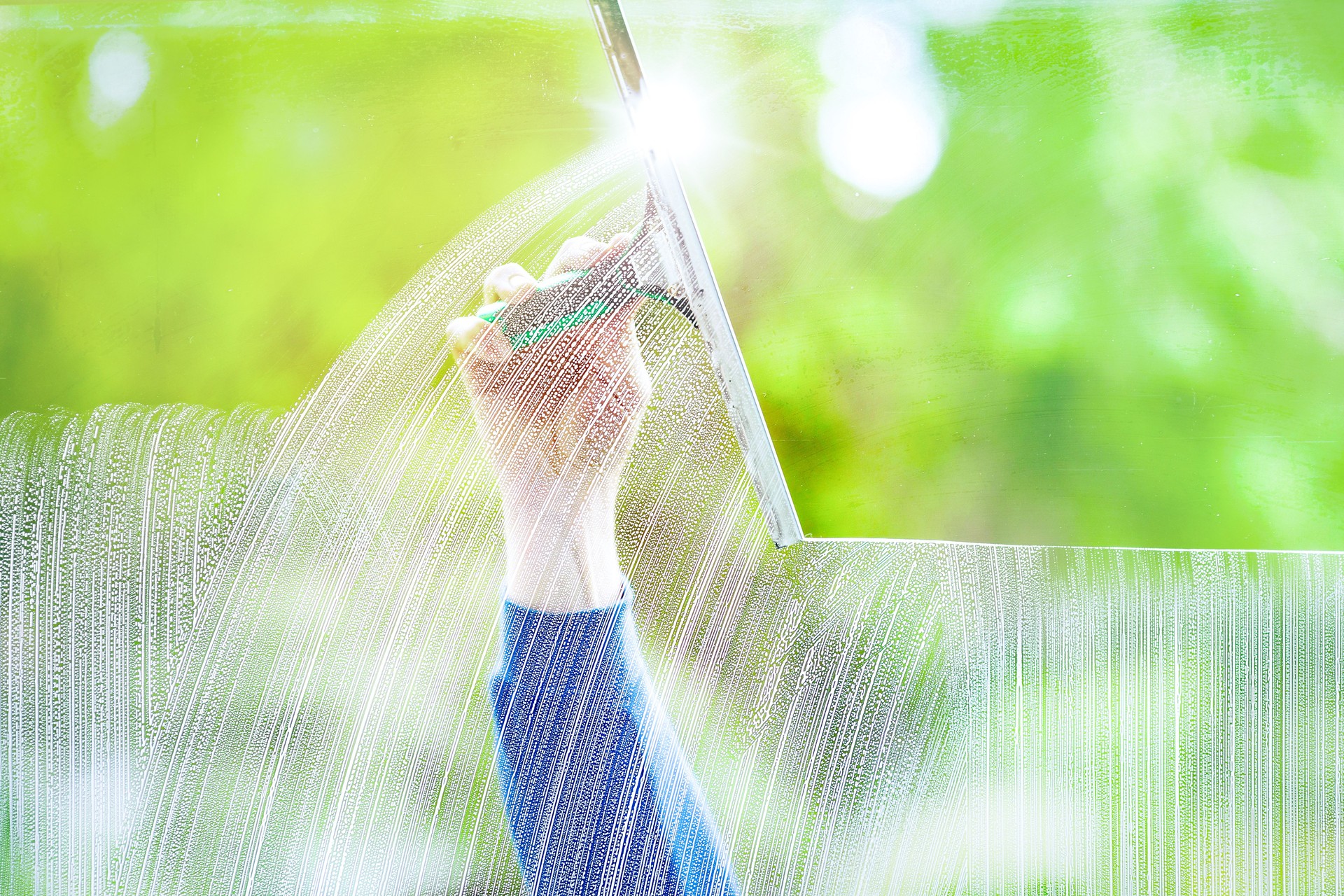 The window cleaner cleans the office windows